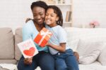 Afro kid congratulating her mom at home