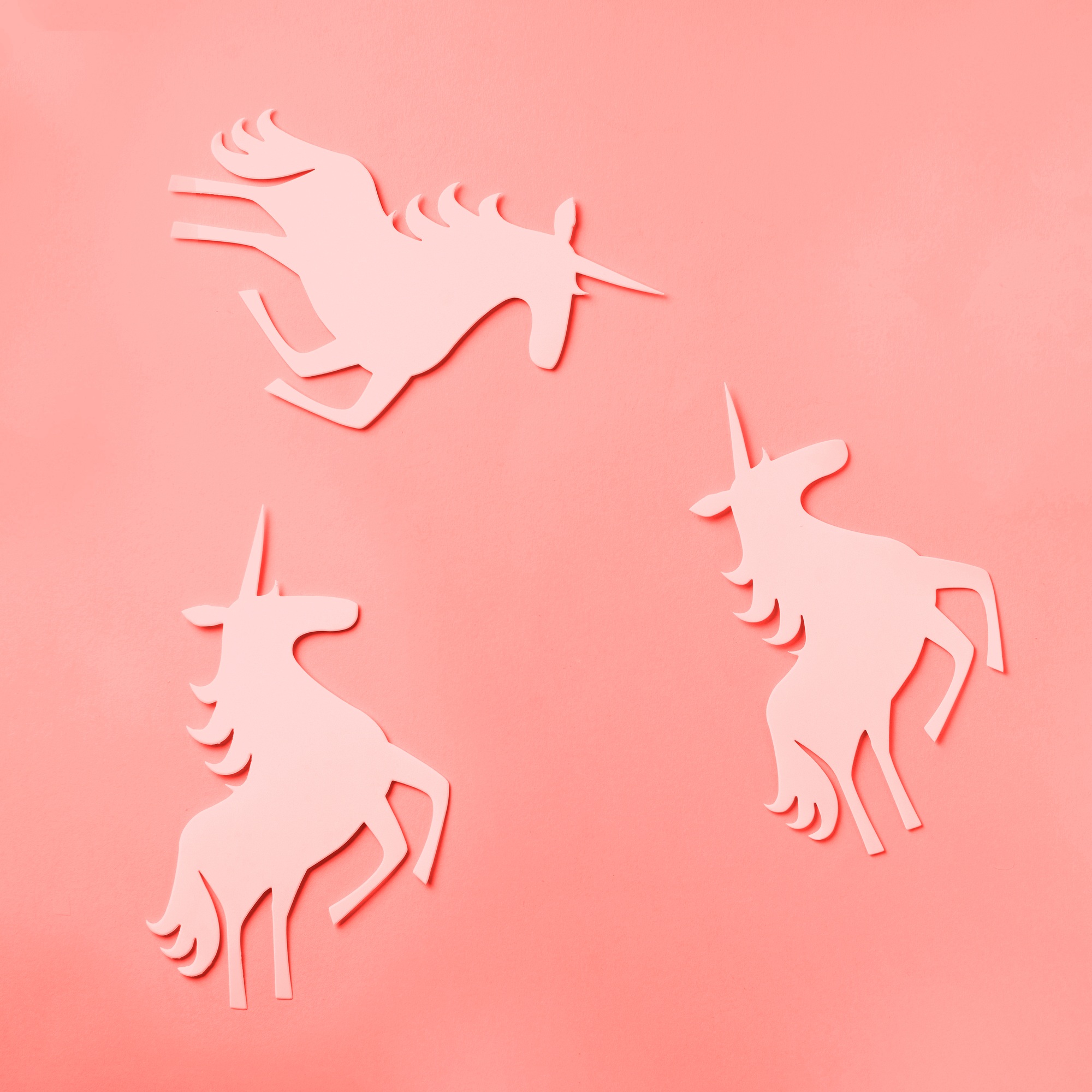 Creative unicorn pattern on trendy coral color background. Abstract art texture Minimal fantasy