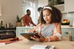 Girl kid, home and drawing on tablet for homeschool, learning and growth or development of motor sk