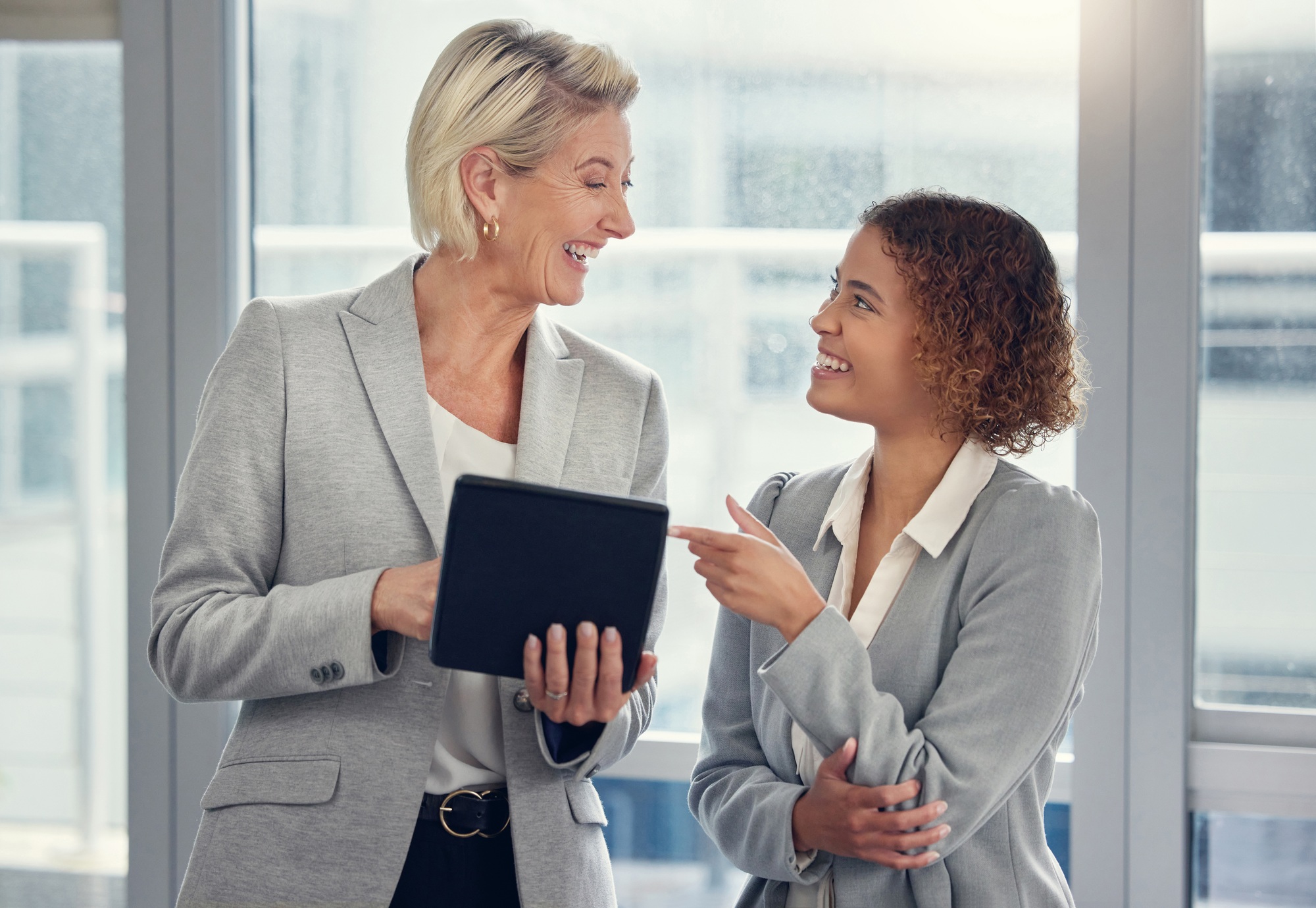Tablet, planning and business women or manager with worker for internship opportunity, training and
